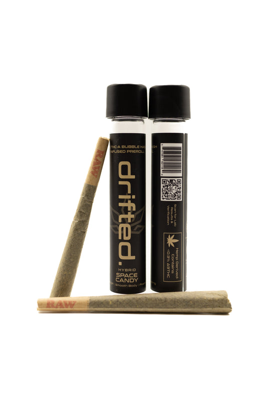 Two Drifted pre-rolled joints with packaging on a white background